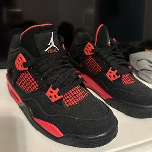 Never worn Red Thunder Jordan 4s. Selling without box.